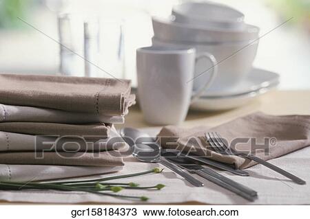 Close-up of cutlery and linen on a table View Large Photo Image Stock Image - Close-up of cutlery and linen on a table. Fotosearch