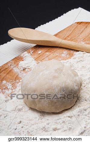 Close-up of dough on a cutting board View Large Photo Image Picture - Close-up of dough on a cutting board. Fotosearch