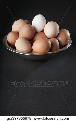 Close-up of eggs in a bowl View Large Photo Image Stock Photo - Close-up of eggs in a bowl. Fotosearch