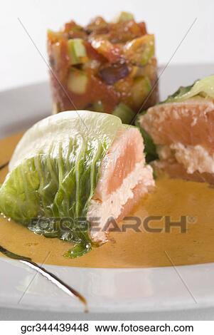 Close-up of fish steaks wrapped in cabbage leaves View Large Photo Image Stock Photo - Close-up of fish steaks wrapped in cabbage leaves. Fotosearch