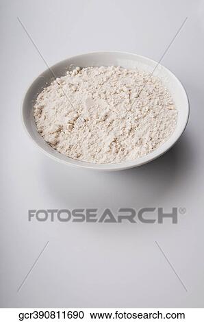 Stock Image - Close-up of flour in a bowl. Fotosearch