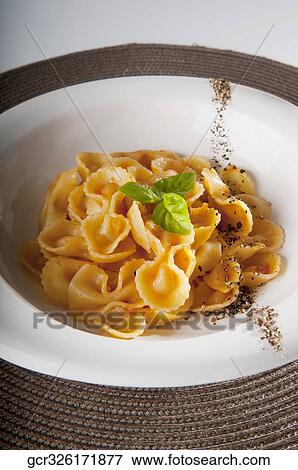 Close-up of fresh pepper and basil garnished pasta View Large Photo Image Stock Photo - Close-up of fresh pepper and basil garnished pasta. Fotosearch