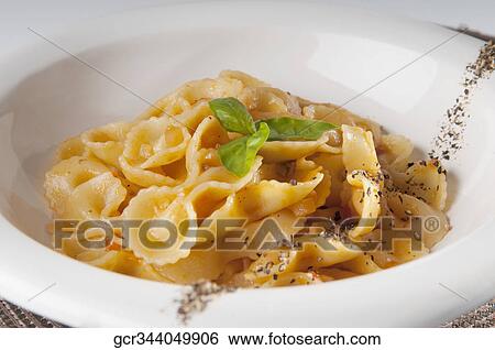 Close-up of fresh pepper and basil garnished pasta View Large Photo Image Stock Photograph - Close-up of fresh pepper and basil garnished pasta. Fotosearch