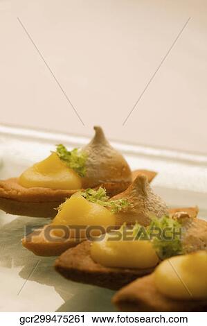 Close-up of fruit meringue tarts View Large Photo Image Stock Image - Close-up of fruit meringue tarts. Fotosearch