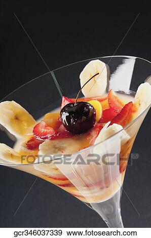Close-up of fruit trifle in a martini glass View Large Photo Image Stock Photo - Close-up of fruit trifle in a martini glass. Fotosearch