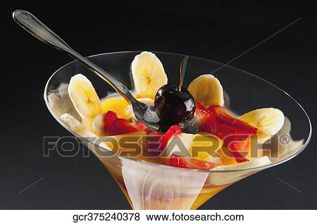 Close-up of fruit trifle in a martini glass View Large Photo Image Stock Photo - Close-up of fruit trifle in a martini glass. Fotosearch