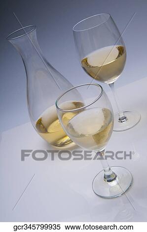 Close-up of glasses of white wine View Large Photo Image Stock Photography - Close-up of glasses of white wine. Fotosearch