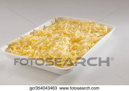 Close-up of grated parmesan cheese View Large Photo Image Stock Image - Close-up of grated parmesan cheese. Fotosearch