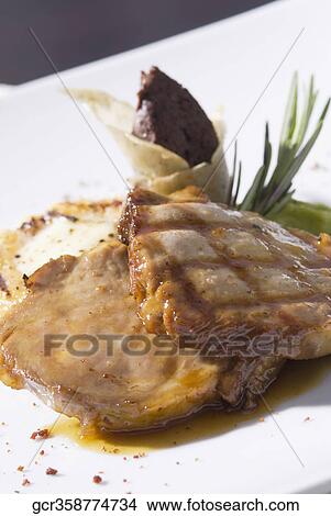 Close-up of grilled steaks in sauce View Large Photo Image Picture - Close-up of grilled steaks in sauce. Fotosearch
