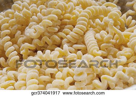 Close-up of homemade spiral pasta View Large Photo Image Stock Photo - Close-up of homemade spiral pasta. Fotosearch