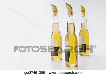 Close-up of lemon slices with lemon juice bottles View Large Photo Image Stock Image - Close-up of lemon slices with lemon juice bottles. Fotosearch