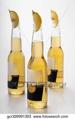 Close-up of lemon wedges in beer bottles View Large Photo Image Stock Image - Close-up of lemon wedges in beer bottles. Fotosearch