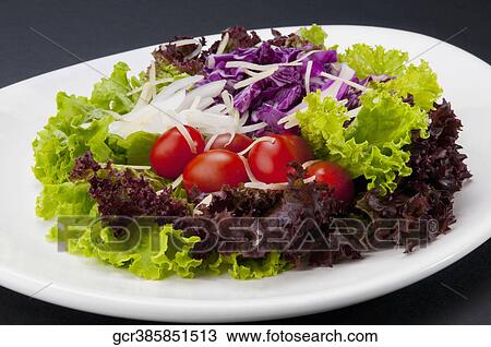 Close-up of lettuce and tomato salad View Large Photo Image Stock Image - Close-up of lettuce and tomato salad. Fotosearch