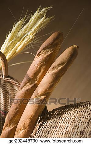 Close-up of loaves of bread in a wicker basket View Large Photo Image Stock Image - Close-up of loaves of bread in a wicker basket. Fotosearch