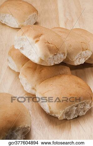 Close-up of loaves of bread on a cutting board View Large Photo Image Picture - Close-up of loaves of bread on a cutting board. Fotosearch