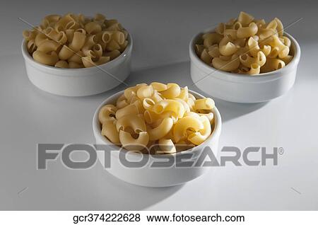 Close-up of macaroni in bowls View Large Photo Image Stock Photo - Close-up of macaroni in bowls. Fotosearch