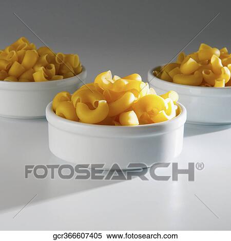 Close-up of macaroni in bowls View Large Photo Image Stock Photography - Close-up of macaroni in bowls. Fotosearch