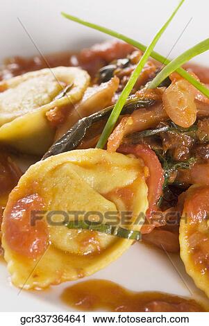 Close-up of meat and tortellini View Large Photo Image Stock Image - Close-up of meat and tortellini. Fotosearch