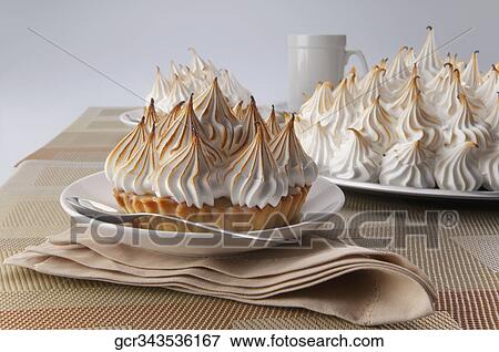 Close-up of meringue pies with a coffee cup View Large Photo Image Stock Photo - Close-up of meringue pies with a coffee cup. Fotosearch