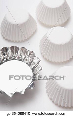 Close-up of metal and paper cupcake moulds View Large Photo Image Stock Image - Close-up of metal and paper cupcake moulds. Fotosearch