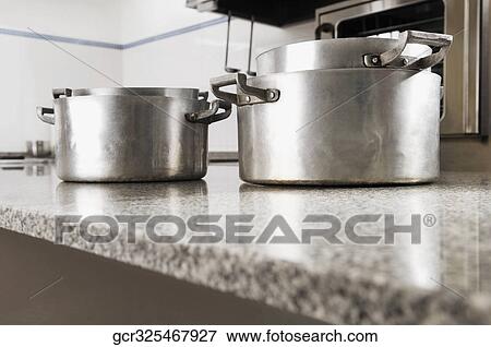 Close-up of pans in the kitchen View Large Photo Image Stock Photo - Close-up of pans in the kitchen. Fotosearch
