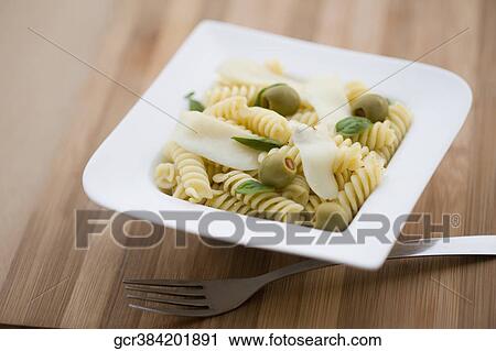 Close-up of pasta in a bowl View Large Photo Image Stock Image - Close-up of pasta in a bowl. Fotosearch