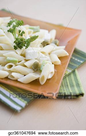 Close-up of pasta in a plate View Large Photo Image Picture - Close-up of pasta in a plate. Fotosearch