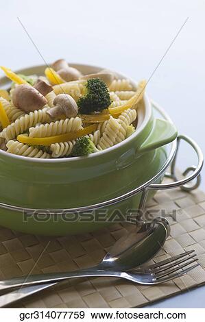 Stock Photo - Close-up of pasta with tableware. Fotosearch