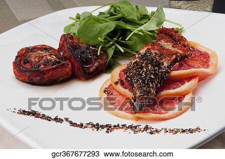 Close-up of pepper coated chops with grapefruit View Large Photo Image Stock Image - Close-up of pepper coated chops with grapefruit. Fotosearch