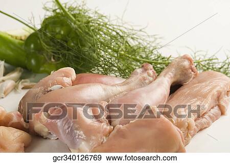 Stock Photo - Close-up of raw chicken with vegetables. Fotosearch