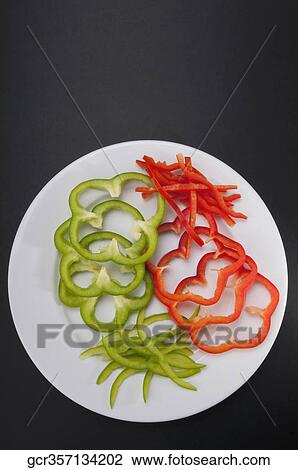 Close-up of raw sliced peppers View Large Photo Image Stock Image - Close-up of raw sliced peppers. Fotosearch