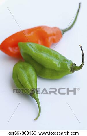 Close-up of red and green chili peppers View Large Photo Image Stock Photograph - Close-up of red and green chili peppers . Fotosearch