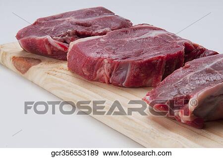 Stock Photo - Close-up of rump steaks. Fotosearch