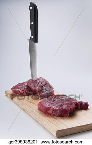 Close-up of rump steaks with a knife View Large Photo Image Stock Image - Close-up of rump steaks with a knife. Fotosearch