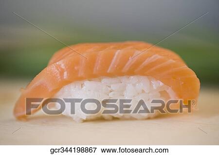 Close-up of salmon nigiri sushi View Large Photo Image Stock Photo - Close-up of salmon nigiri sushi. Fotosearch
