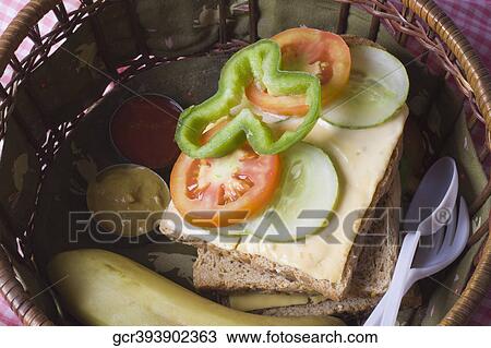 Stock Image - Close-up of sandwiches in a basket. Fotosearch