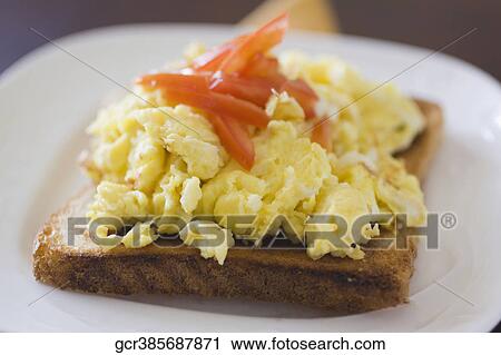 Close-up of scrambled eggs on toast View Large Photo Image Stock Image - Close-up of scrambled eggs on toast. Fotosearch