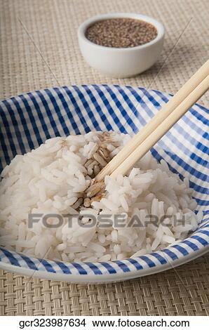 Close-up of sesame seeds on white rice View Large Photo Image Picture - Close-up of sesame seeds on white rice. Fotosearch