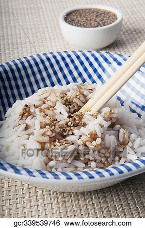 Close-up of sesame seeds on white rice View Large Photo Image Stock Photograph - Close-up of sesame seeds on white rice. Fotosearch