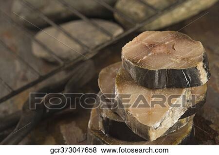 Close-up of slices of fish View Large Photo Image Stock Photo - Close-up of slices of fish. Fotosearch