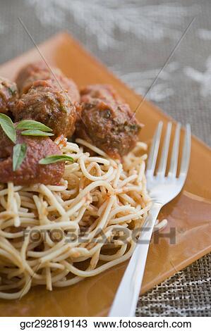 Close-up of spaghetti and meatballs with a fork View Large Photo Image Stock Image - Close-up of spaghetti and meatballs with a fork. Fotosearch