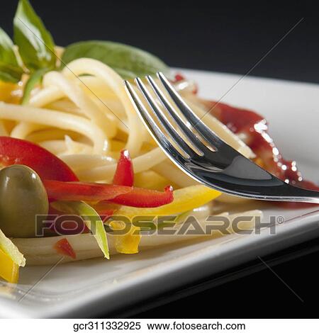 Close-up of spaghetti with bell peppers and olives View Large Photo Image Stock Photography - Close-up of spaghetti with bell peppers and olives. Fotosearch