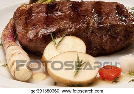 Close-up of sparerib with salad View Large Photo Image Stock Image - Close-up of sparerib with salad. Fotosearch