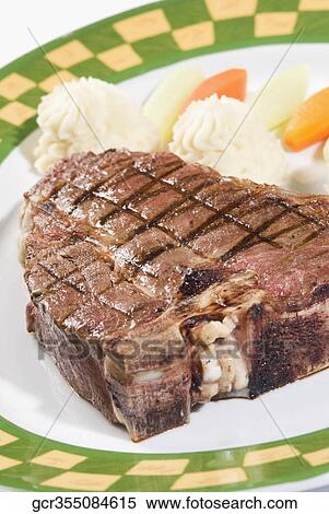 Close-up of steak and mashed potatoes View Large Photo Image Stock Photography - Close-up of steak and mashed potatoes. Fotosearch