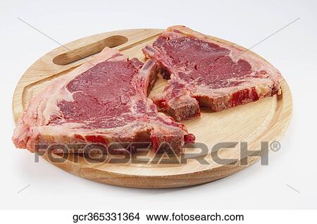 Picture - Close-up of steaks on a cutting board. Fotosearch