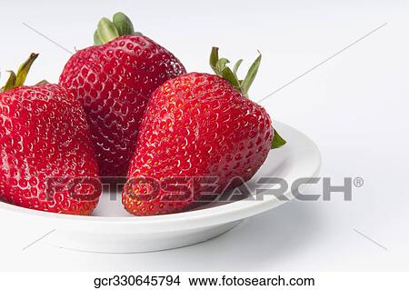 Close-up of strawberries in a plate View Large Photo Image Picture - Close-up of strawberries in a plate. Fotosearch