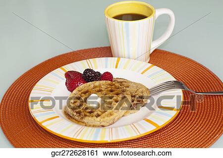 Close-up of strawberries with waffles and a cup of black coffee View Large Photo Image Stock Image - Close-up of strawberries with waffles and a cup of black coffee. Fotosearch