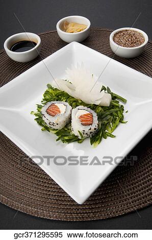 Close-up of sushi rolls served with condiments View Large Photo Image Stock Photography - Close-up of sushi rolls served with condiments. Fotosearch