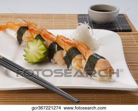 Close-up of sushi with chopsticks and soy sauce View Large Photo Image Picture - Close-up of sushi with chopsticks and soy sauce. Fotosearch