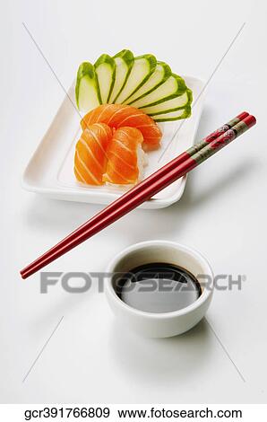 Close-up of sushi with chopsticks and soy sauce View Large Photo Image Stock Photo - Close-up of sushi with chopsticks and soy sauce. Fotosearch